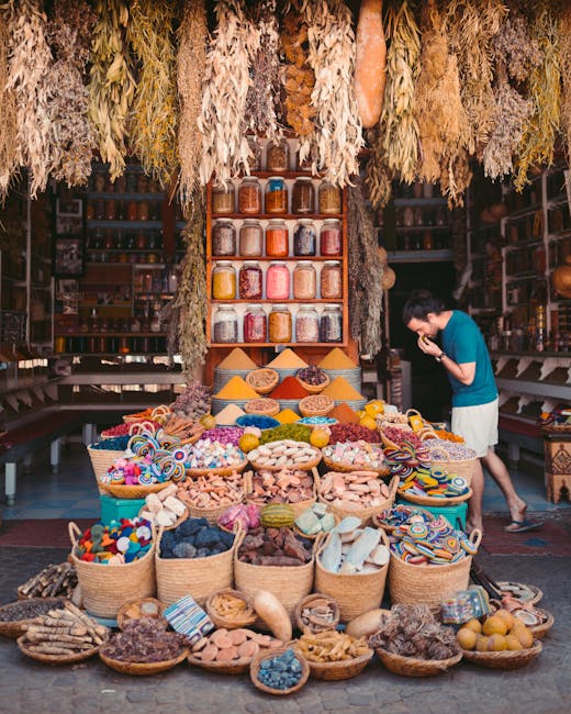 Vibrant display of spices and goods in a Marrakesh street market showcasing Moroccan culture.